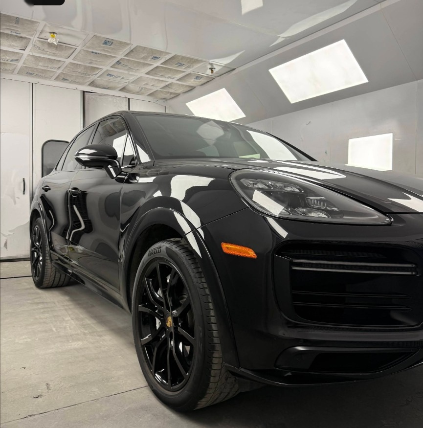 Black Porsche in the paint booth at O.S.S Automotive